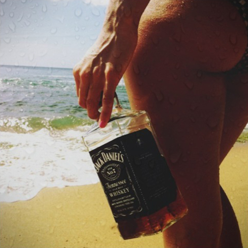 Jack, the beach, and some ass. That sounds like a fuckin good weekend to me.; Ass Babe 